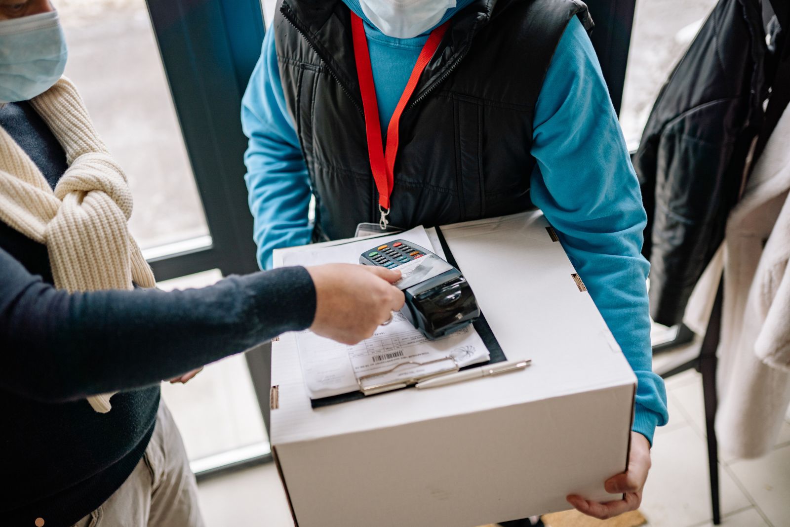 Person browsing on laptop in dimly lit room at night